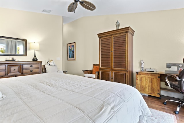bedroom with visible vents, ceiling fan, and wood finished floors