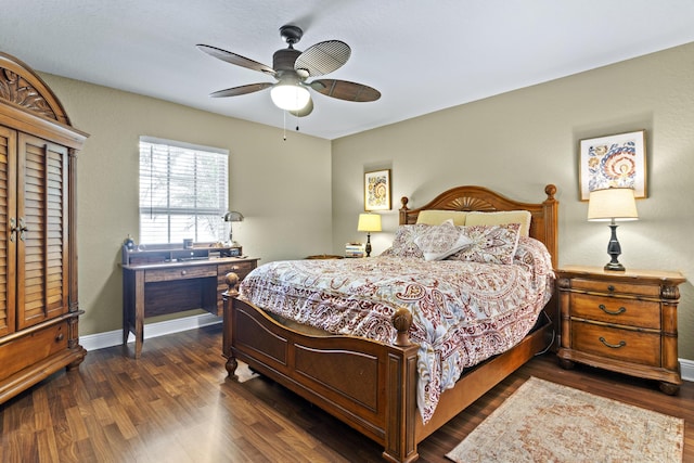 bedroom with baseboards, a ceiling fan, and dark wood finished floors