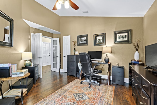office featuring ceiling fan, visible vents, dark wood-style floors, and baseboards