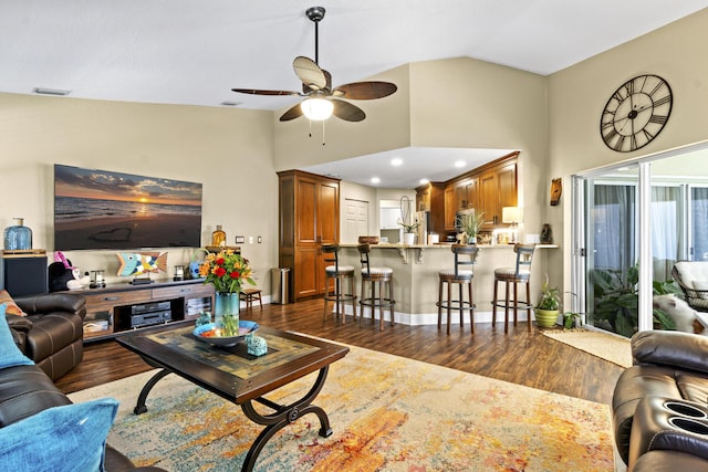 living room with visible vents, high vaulted ceiling, dark wood-type flooring, recessed lighting, and a ceiling fan