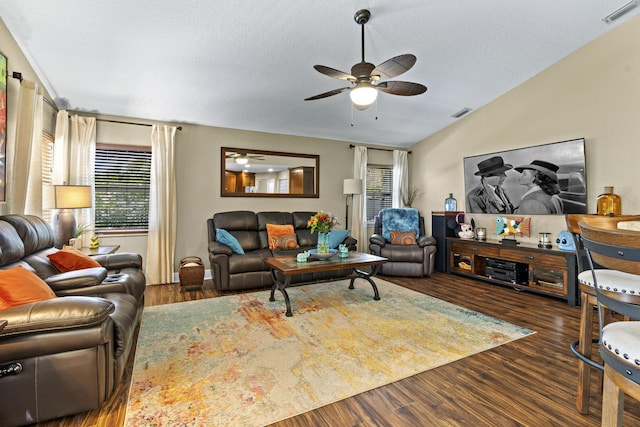 living room featuring plenty of natural light, a ceiling fan, wood finished floors, and visible vents