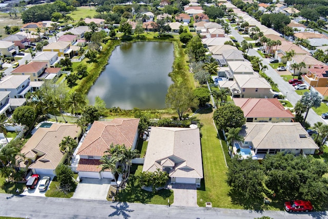 drone / aerial view with a water view and a residential view