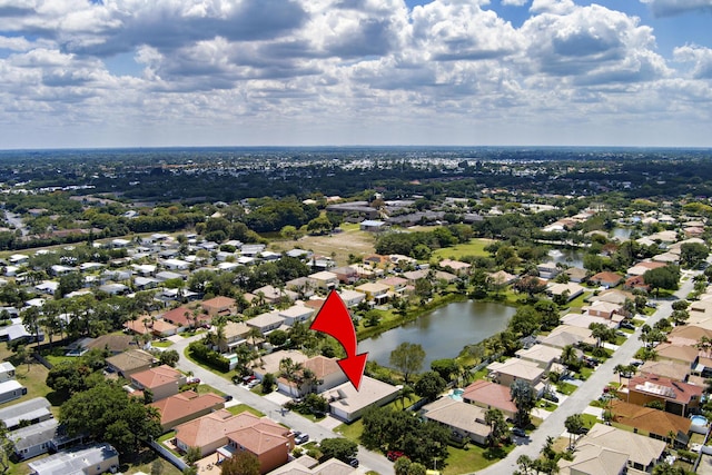birds eye view of property featuring a residential view and a water view