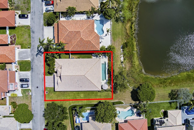 aerial view with a water view and a residential view