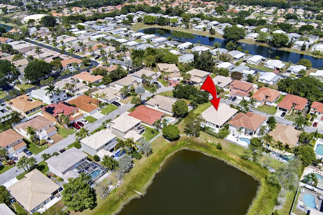 birds eye view of property featuring a water view and a residential view