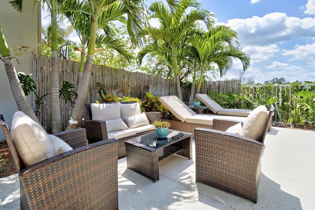 view of patio featuring a fenced backyard and an outdoor living space