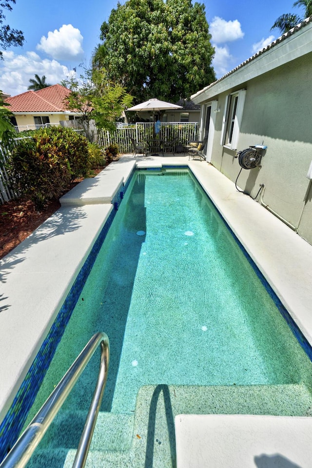 view of pool featuring fence and a fenced in pool