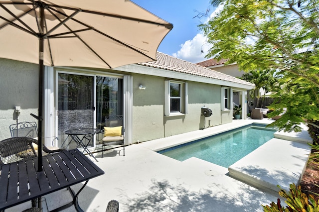 view of pool with fence, a fenced in pool, and a patio area