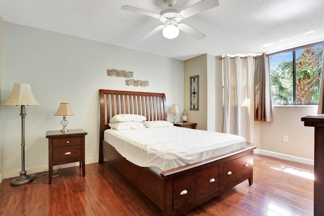 7451 NW 16th St Unit 303, Plantation, FL 33313 - bedroom with baseboards, a ceiling fan, wood finished floors, and a textured ceiling