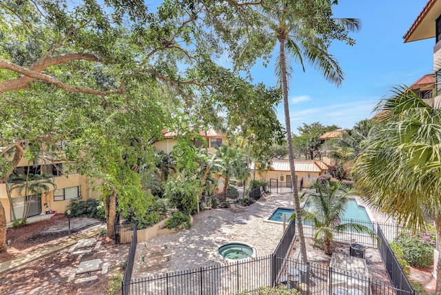 7451 NW 16th St Unit 303, Plantation, FL 33313 - community pool with fence, a hot tub, and a patio