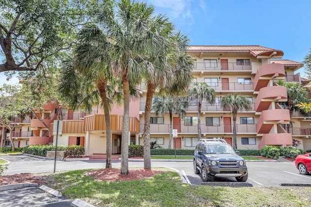 7451 NW 16th St Unit 303, Plantation, FL 33313 - view of building exterior with uncovered parking
