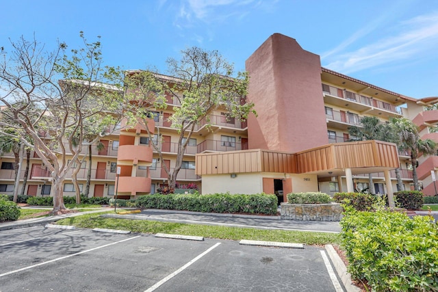 7451 NW 16th St Unit 303, Plantation, FL 33313 - view of property featuring uncovered parking