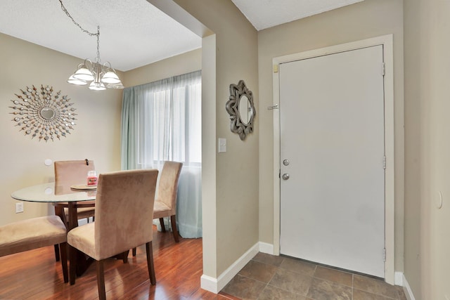 7451 NW 16th St Unit 303, Plantation, FL 33313 - dining room with baseboards and a chandelier