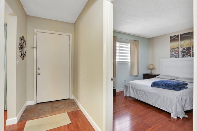 7451 NW 16th St Unit 303, Plantation, FL 33313 - interior space with wood finished floors, a textured ceiling, and baseboards