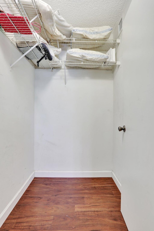 7451 NW 16th St Unit 303, Plantation, FL 33313 - walk in closet featuring visible vents and wood finished floors