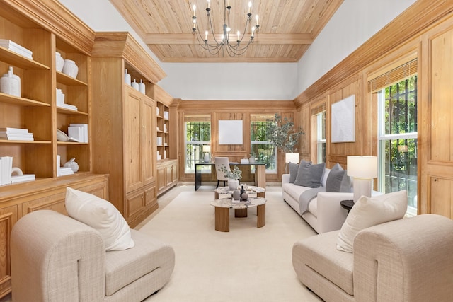living area with wood ceiling, built in shelves, beamed ceiling, a high ceiling, and a notable chandelier
