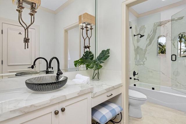 bathroom with enclosed tub / shower combo, toilet, ornamental molding, and vanity