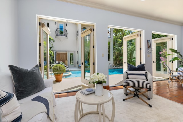 interior space featuring tile patterned flooring and ornamental molding