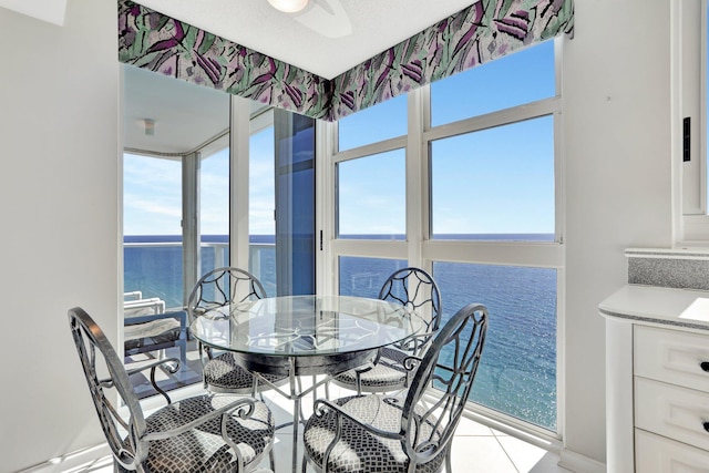 1360 S Ocean Blvd Unit 2508, Pompano Beach, FL 33062 - dining space with a water view and light tile patterned flooring