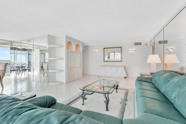1360 S Ocean Blvd Unit 2508, Pompano Beach, FL 33062 - living room with a textured ceiling, tile patterned flooring, and built in features