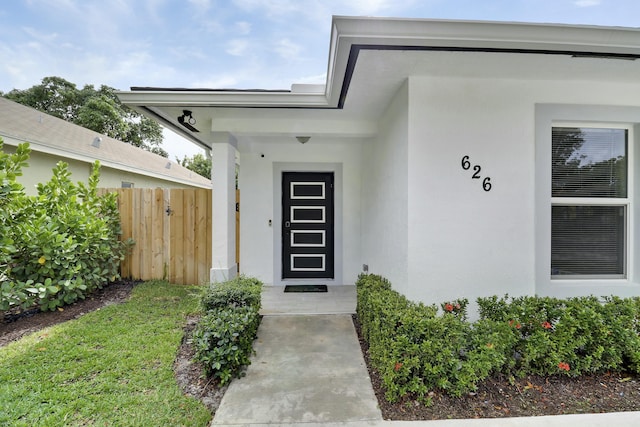 626 33rd St, West Palm Beach, FL 33407 - view of exterior entry with stucco siding