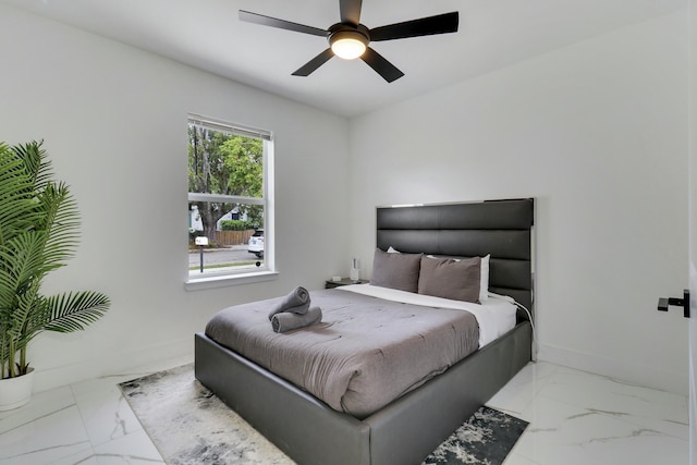 626 33rd St, West Palm Beach, FL 33407 - bedroom with light marble finish floors, baseboards, and a ceiling fan