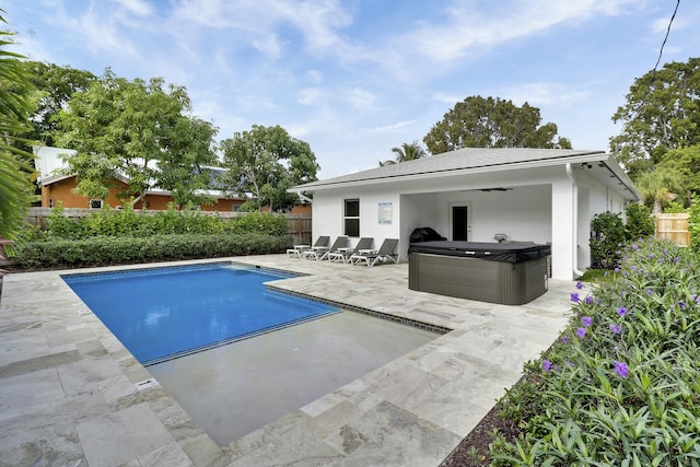 626 33rd St, West Palm Beach, FL 33407 - view of pool featuring a hot tub, a patio, ceiling fan, and a fenced backyard