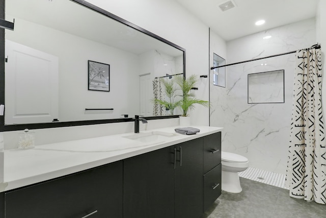 626 33rd St, West Palm Beach, FL 33407 - bathroom with vanity, toilet, and a marble finish shower