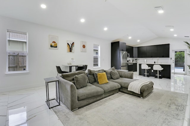 626 33rd St, West Palm Beach, FL 33407 - living room with light marble finish flooring, recessed lighting, lofted ceiling, and baseboards