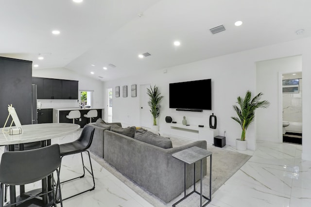 626 33rd St, West Palm Beach, FL 33407 - living room with light marble finish floors, lofted ceiling, and recessed lighting