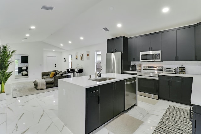 626 33rd St, West Palm Beach, FL 33407 - kitchen featuring appliances with stainless steel finishes, a sink, dark cabinets, light countertops, and recessed lighting