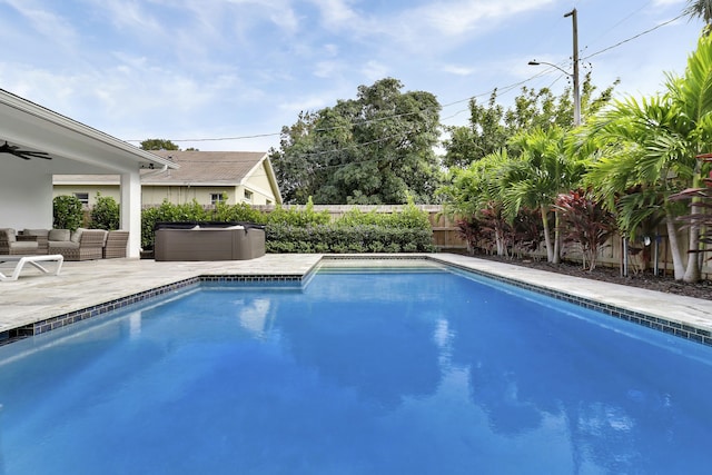 626 33rd St, West Palm Beach, FL 33407 - view of swimming pool featuring an outdoor living space, a fenced backyard, ceiling fan, and a patio area