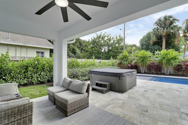 626 33rd St, West Palm Beach, FL 33407 - fenced backyard with a hot tub, ceiling fan, and a patio