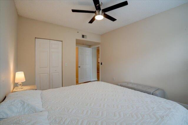 2221 Tuscany Way, Boynton Beach, FL 33435 - bedroom with baseboards, light wood-style floors, visible vents, and a closet