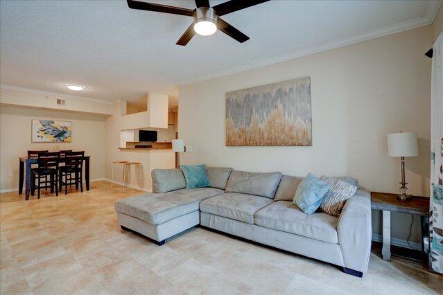 2221 Tuscany Way, Boynton Beach, FL 33435 - dining area featuring a textured ceiling, crown molding, baseboards, and visible vents