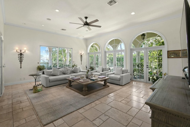 201 Avila Rd, West Palm Beach, FL 33405 - living room featuring stone tile flooring, ceiling fan, recessed lighting, ornamental molding, and french doors