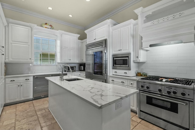 201 Avila Rd, West Palm Beach, FL 33405 - kitchen with built in appliances, a sink, white cabinets, ornamental molding, and recessed lighting
