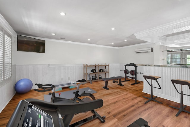 201 Avila Rd, West Palm Beach, FL 33405 - workout room with a wainscoted wall, ornamental molding, a wall mounted AC, wood finished floors, and recessed lighting