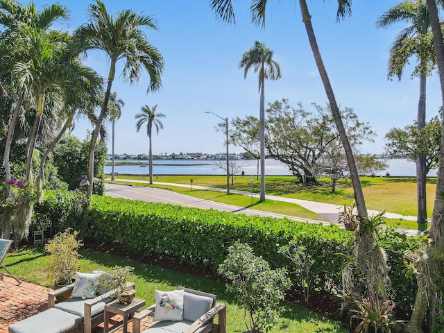 201 Avila Rd, West Palm Beach, FL 33405 - view of home's community featuring a water view, outdoor lounge area, and a lawn