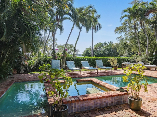 201 Avila Rd, West Palm Beach, FL 33405 - view of pool featuring a patio and a pool with connected hot tub