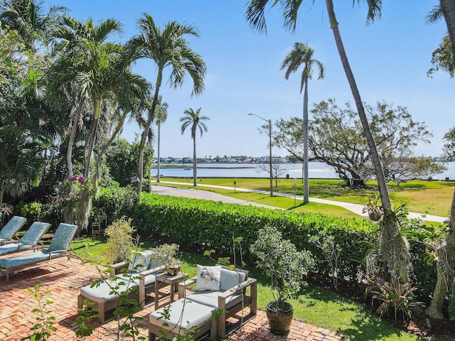 201 Avila Rd, West Palm Beach, FL 33405 - view of yard featuring a water view, a patio, and outdoor lounge area