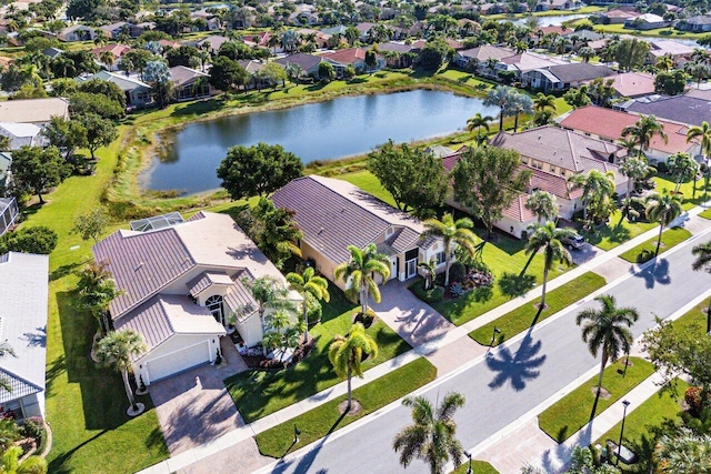 drone / aerial view featuring a water view and a residential view