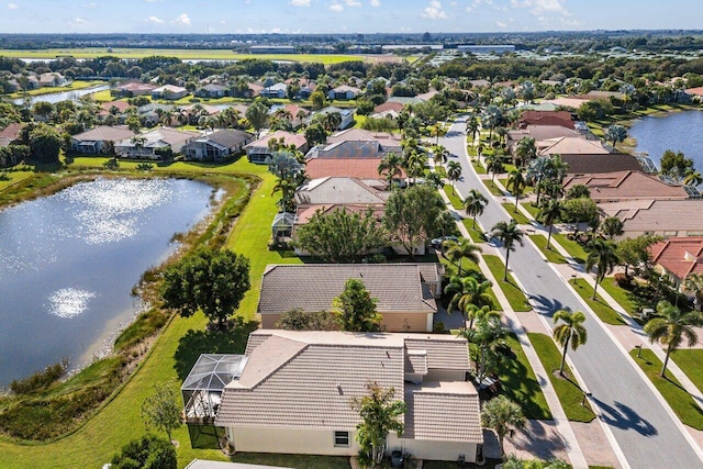 bird's eye view featuring a residential view and a water view