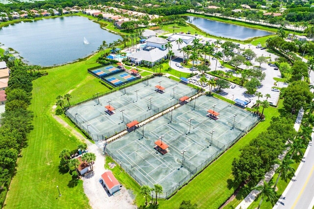 birds eye view of property with a water view