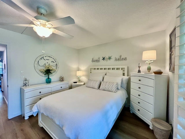 214 Tilford K, Deerfield Beach, FL 33442 - bedroom with a textured ceiling, a ceiling fan, and dark wood finished floors
