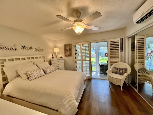 214 Tilford K, Deerfield Beach, FL 33442 - bedroom with a textured ceiling, dark wood finished floors, access to outside, and a wall unit AC