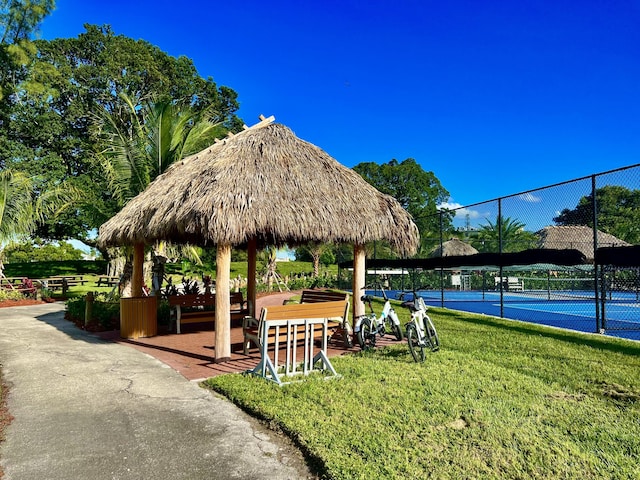 214 Tilford K, Deerfield Beach, FL 33442 - view of property's community featuring a tennis court, a gazebo, a yard, and fence