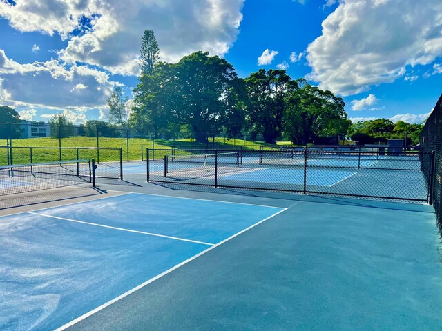 214 Tilford K, Deerfield Beach, FL 33442 - view of sport court featuring fence
