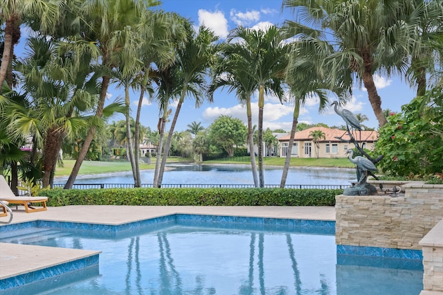 view of pool featuring a fenced in pool, a water view, and fence