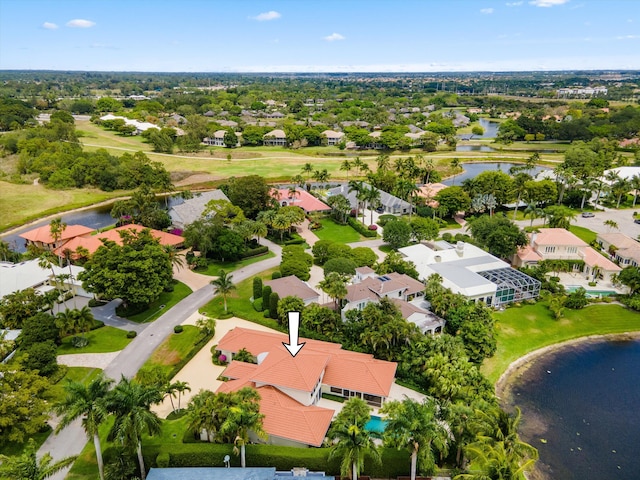 bird's eye view featuring a residential view and a water view